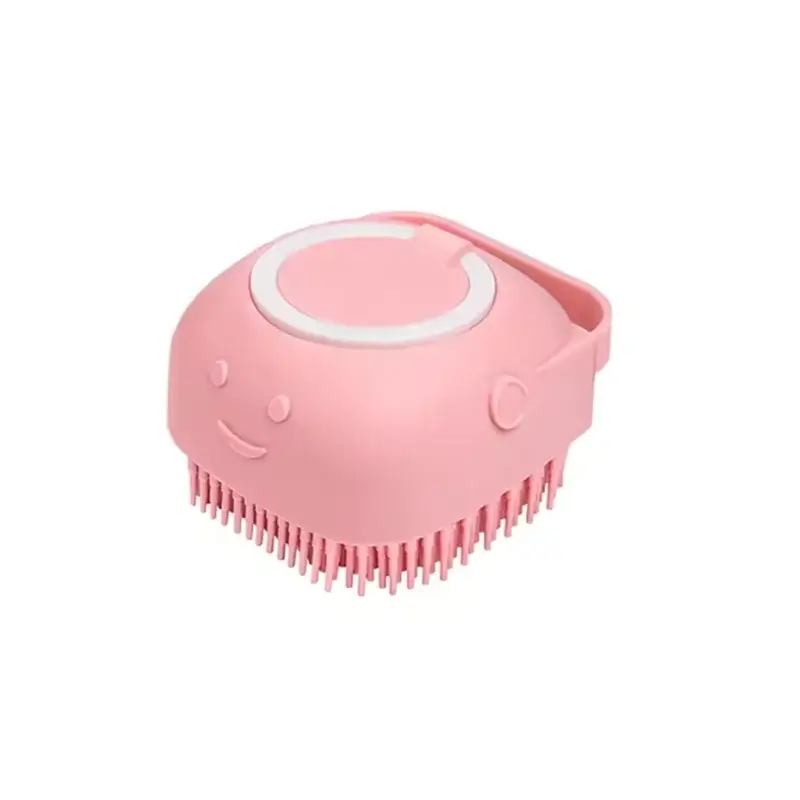 Pet bath brush silicone grooming tool in cute pink design with smiley face for dogs and cats.