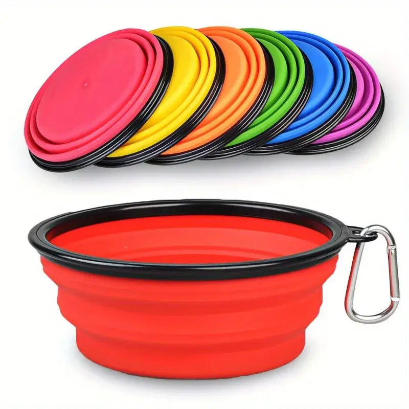 Folding dog bowl for camping in red color with various colorful collapsible bowls displayed in the background.